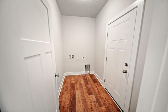 clothes washing area with washer hookup, hardwood / wood-style floors, a textured ceiling, and electric dryer hookup