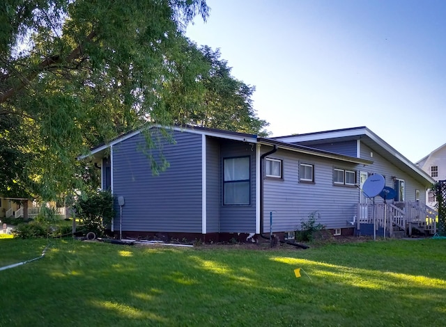 rear view of house with a lawn