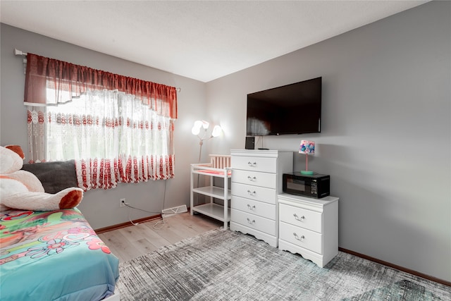 bedroom with light hardwood / wood-style floors