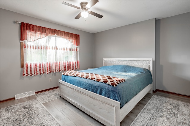 bedroom featuring ceiling fan and hardwood / wood-style flooring