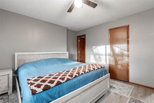 bedroom featuring ceiling fan and light hardwood / wood-style flooring