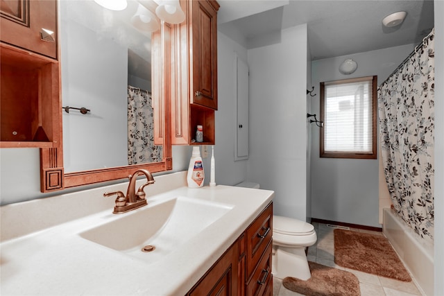 full bathroom featuring tile patterned flooring, vanity, toilet, and shower / bath combo with shower curtain