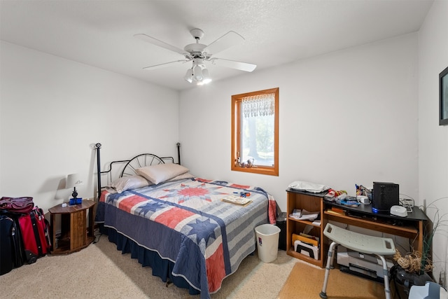 bedroom featuring ceiling fan and light colored carpet