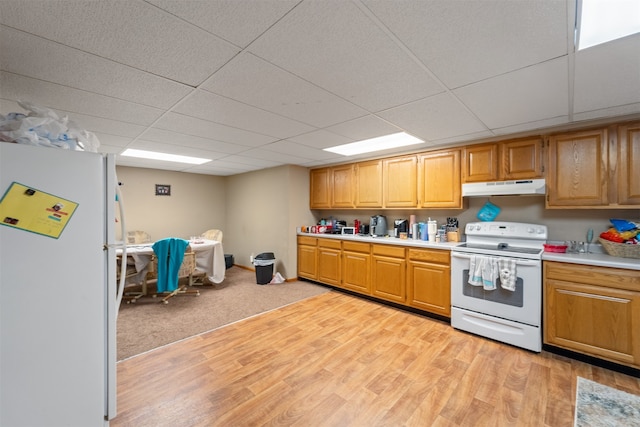 kitchen with light hardwood / wood-style flooring, white appliances, and a drop ceiling