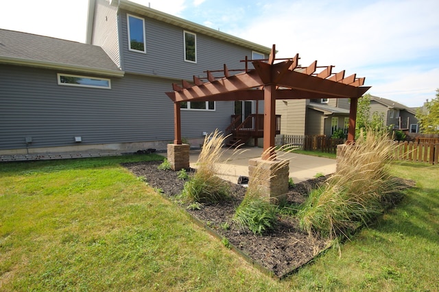 back of property featuring a yard, a pergola, and a patio