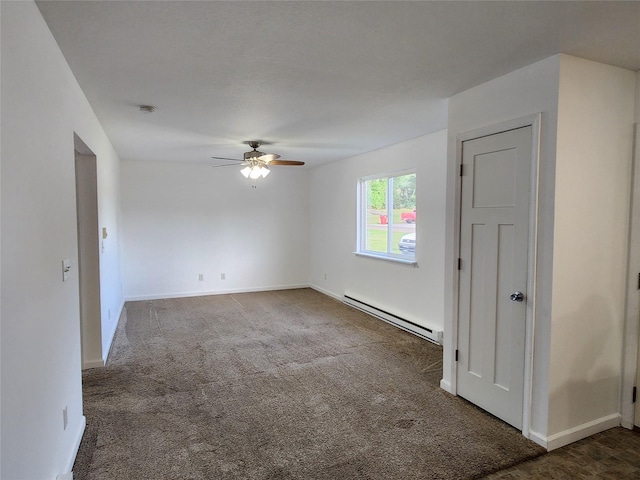 621/623 Burlington St, Harvey, IA 50119 - unfurnished room with a baseboard radiator, baseboards, carpet flooring, and a ceiling fan
