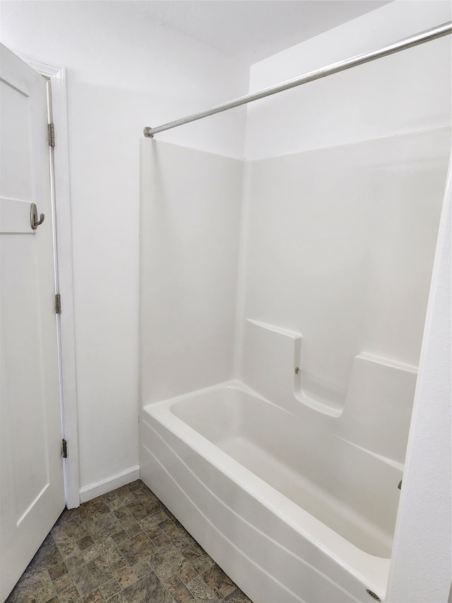 bathroom featuring washtub / shower combination