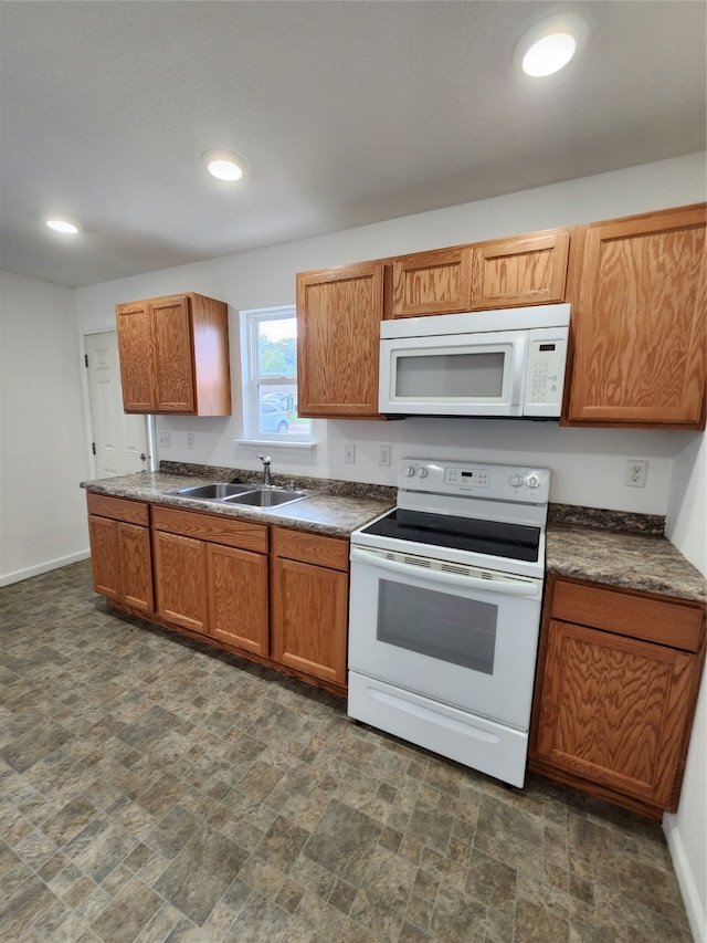 kitchen with sink and white appliances