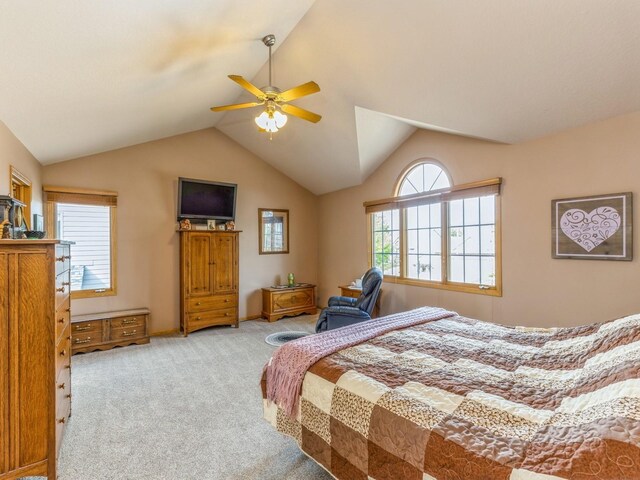 carpeted bedroom featuring ceiling fan and lofted ceiling