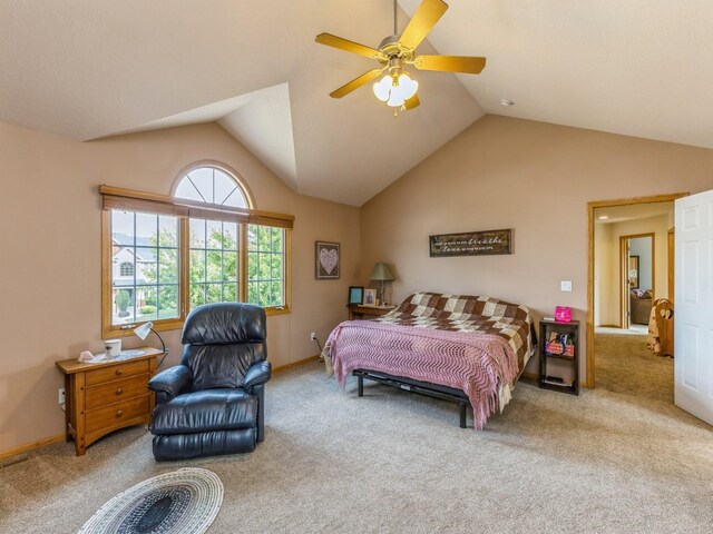 carpeted bedroom with vaulted ceiling and ceiling fan