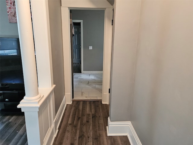 hallway featuring dark hardwood / wood-style flooring