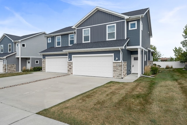 view of front facade with a garage and a front lawn