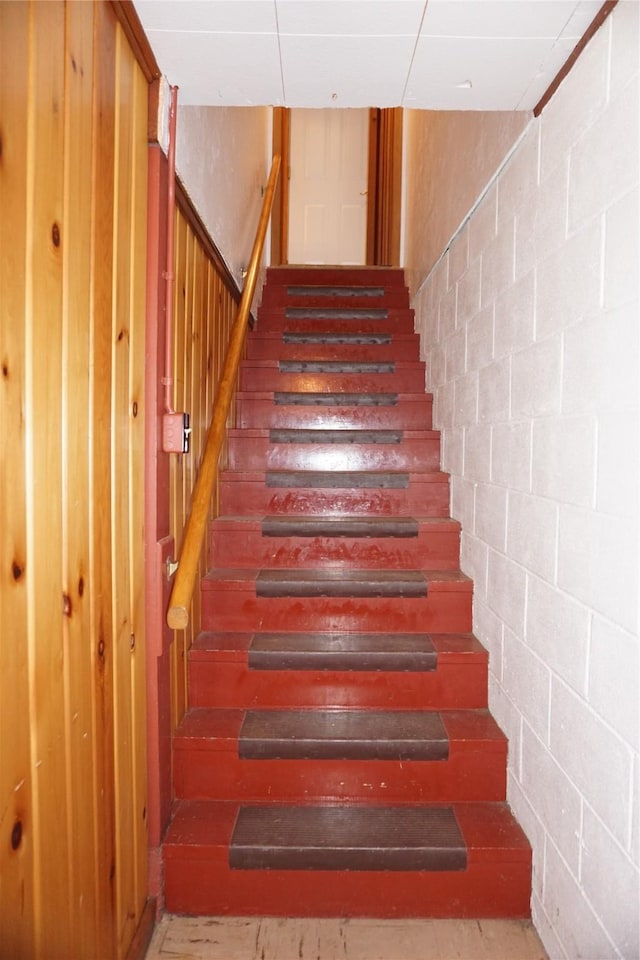 stairway with concrete block wall