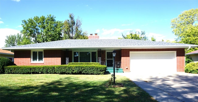 ranch-style home with a garage, driveway, brick siding, and a front lawn