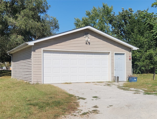 garage with wooden walls and a yard