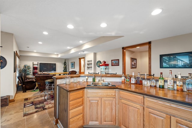 kitchen with light brown cabinets and sink