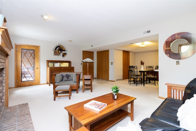 carpeted living room with a fireplace