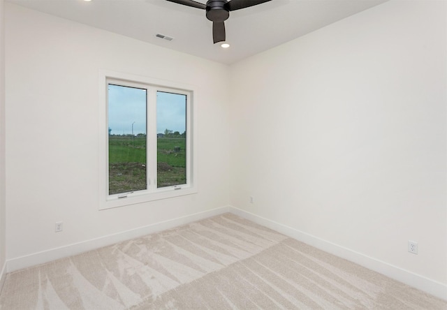 unfurnished room featuring a ceiling fan, visible vents, baseboards, carpet floors, and recessed lighting
