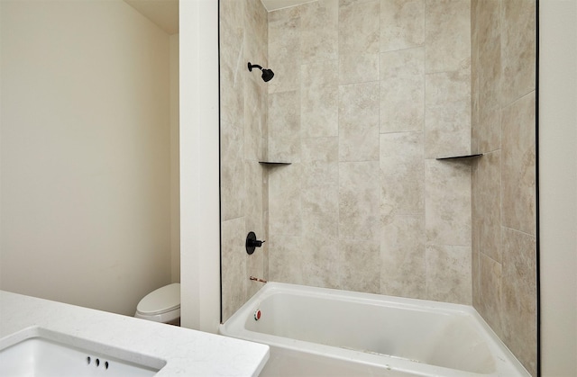 bathroom with shower / washtub combination, vanity, and toilet