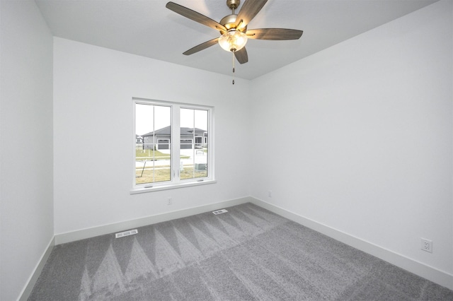 empty room with carpet flooring and ceiling fan