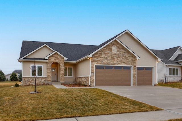 view of front facade featuring a garage and a front lawn