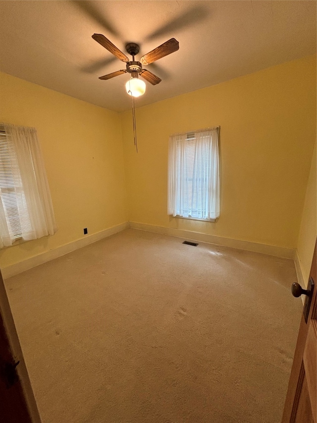 carpeted empty room with ceiling fan