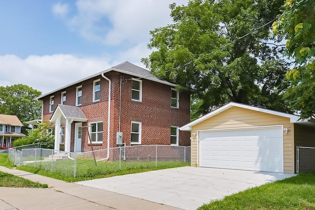 view of front of property featuring a garage and an outdoor structure