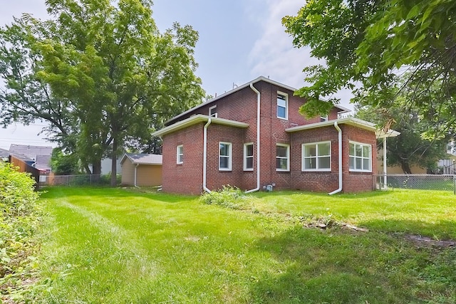 view of side of home featuring a lawn