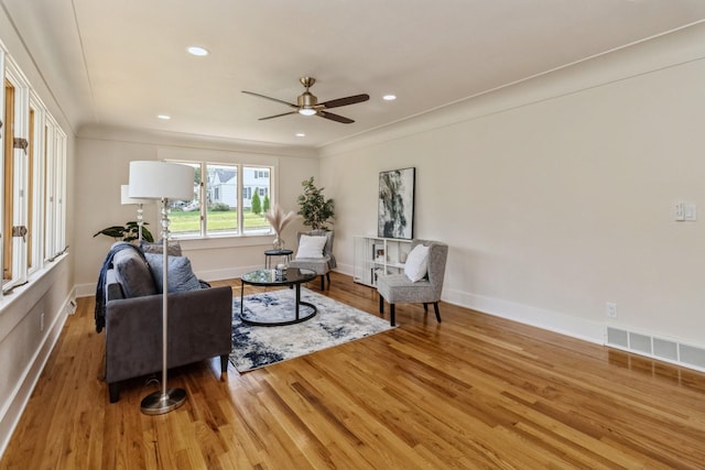 sitting room featuring a ceiling fan, wood finished floors, baseboards, visible vents, and recessed lighting