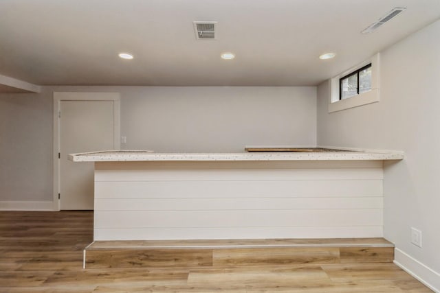 bar with visible vents, recessed lighting, and light wood-style floors