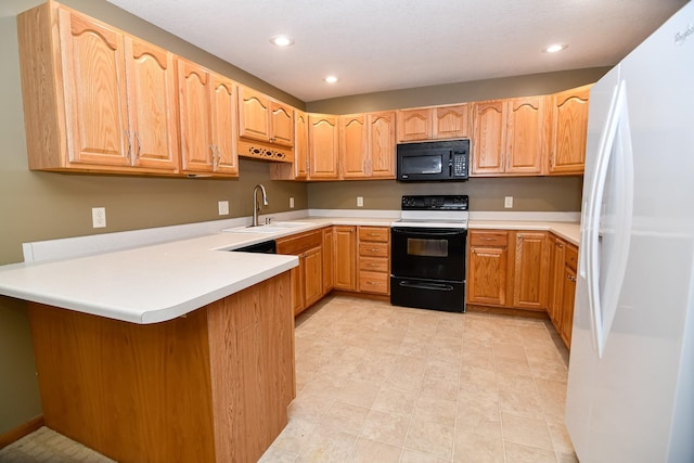 kitchen featuring kitchen peninsula, white appliances, and sink