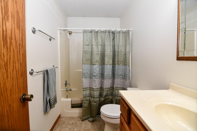 full bathroom with vanity, shower / tub combo, and toilet