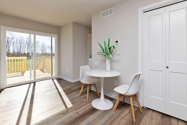 161 NE 56th St, Pleasant Hill, IA 50327 - dining room featuring wood finished floors and baseboards
