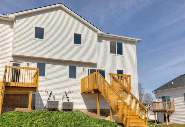 161 NE 56th St, Pleasant Hill, IA 50327 - rear view of house featuring stairs, central air condition unit, and a wooden deck