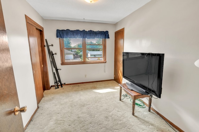 interior space featuring light colored carpet