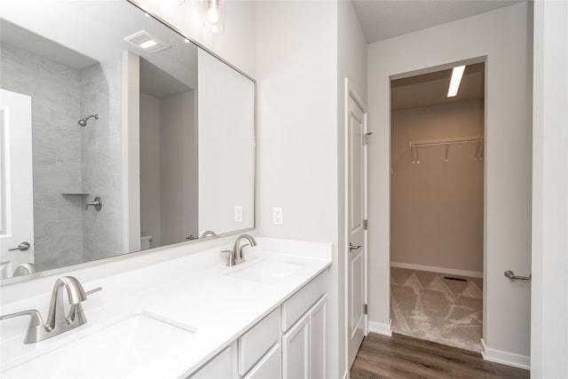 bathroom featuring hardwood / wood-style flooring and vanity