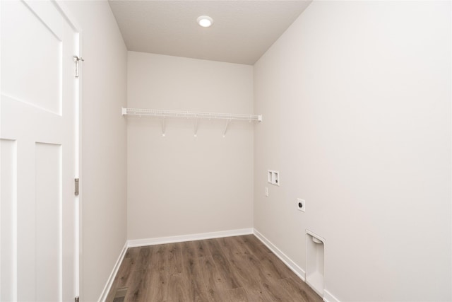 washroom featuring hookup for an electric dryer, hardwood / wood-style floors, and hookup for a washing machine