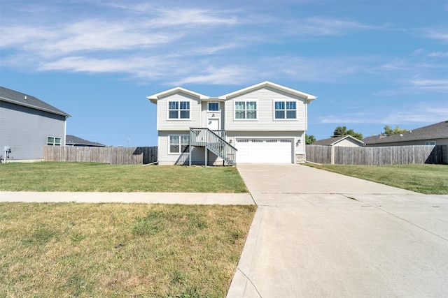 view of front of house featuring a front yard and a garage