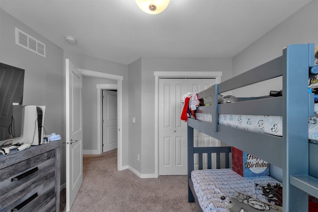 carpeted bedroom featuring a closet