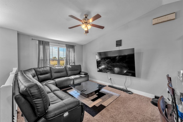 living room featuring vaulted ceiling, ceiling fan, and carpet flooring