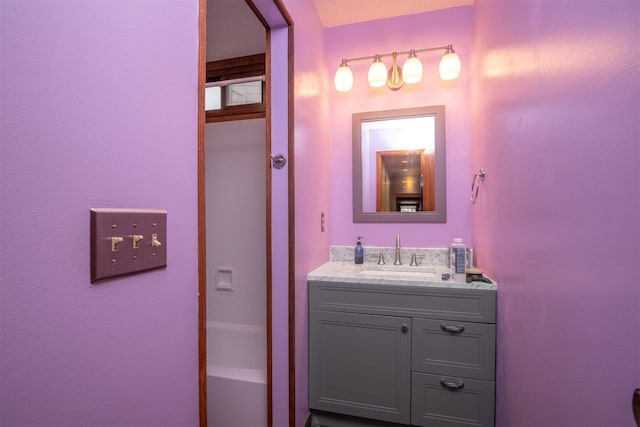 bathroom featuring vanity and a bathing tub