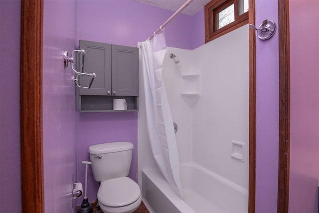 bathroom with shower / bathtub combination with curtain and toilet