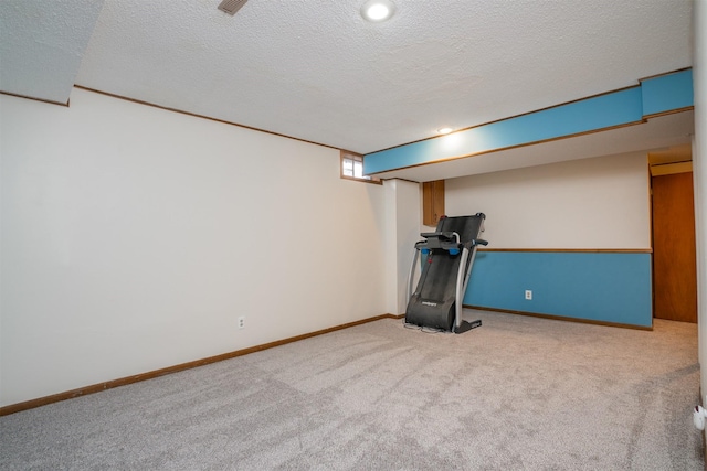 basement with light carpet and a textured ceiling