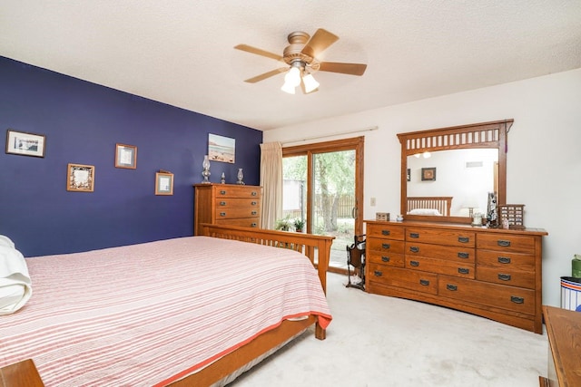 bedroom with light carpet, access to exterior, a textured ceiling, and ceiling fan