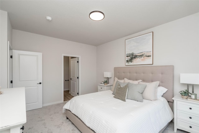 bedroom featuring light colored carpet