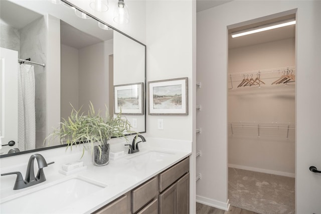 bathroom featuring vanity and wood-type flooring