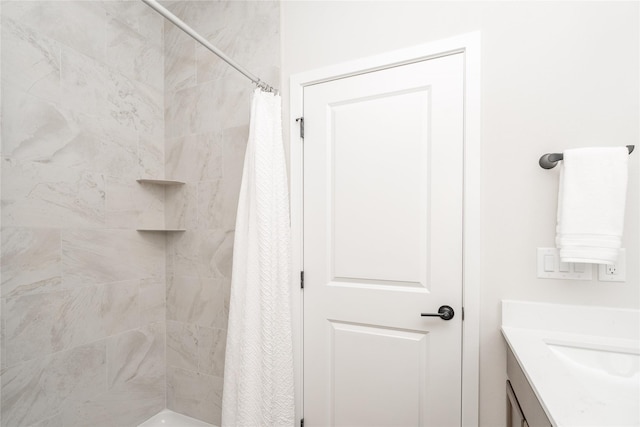 bathroom featuring vanity and walk in shower