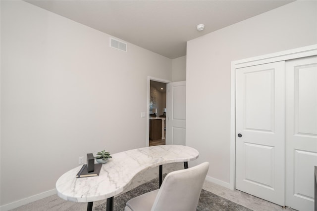 view of carpeted dining space