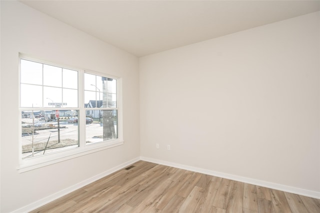 spare room featuring light hardwood / wood-style floors