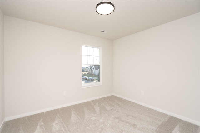 spare room featuring carpet floors